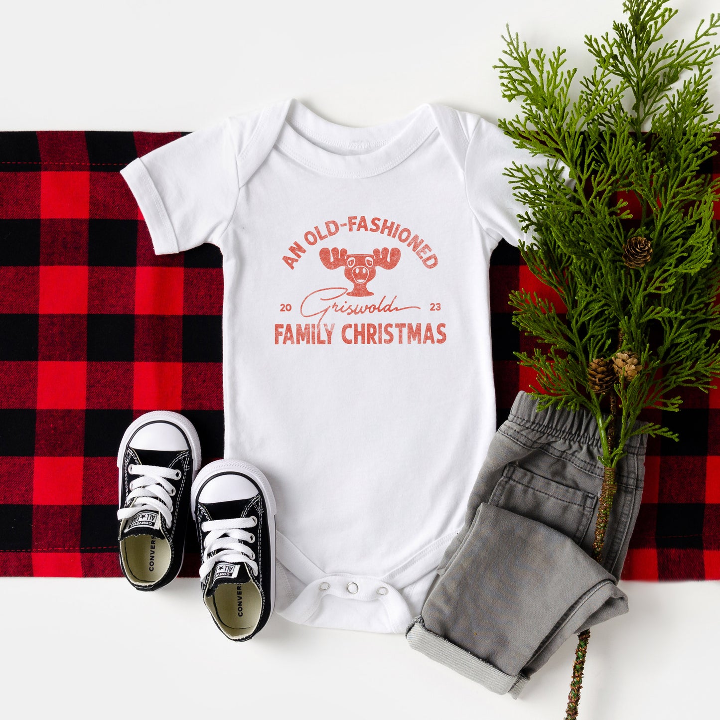 an old-fashioned Griswold family christmas baby onesie in white