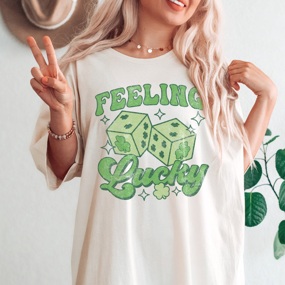 a young woman wearing an oversized feeling lucky tee in Ivory